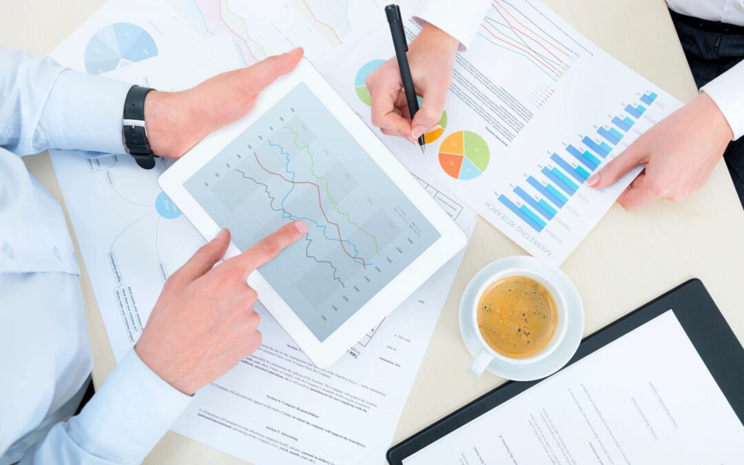 Financial advisors working with pages that have graphs