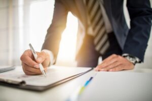 Man writing on paper
