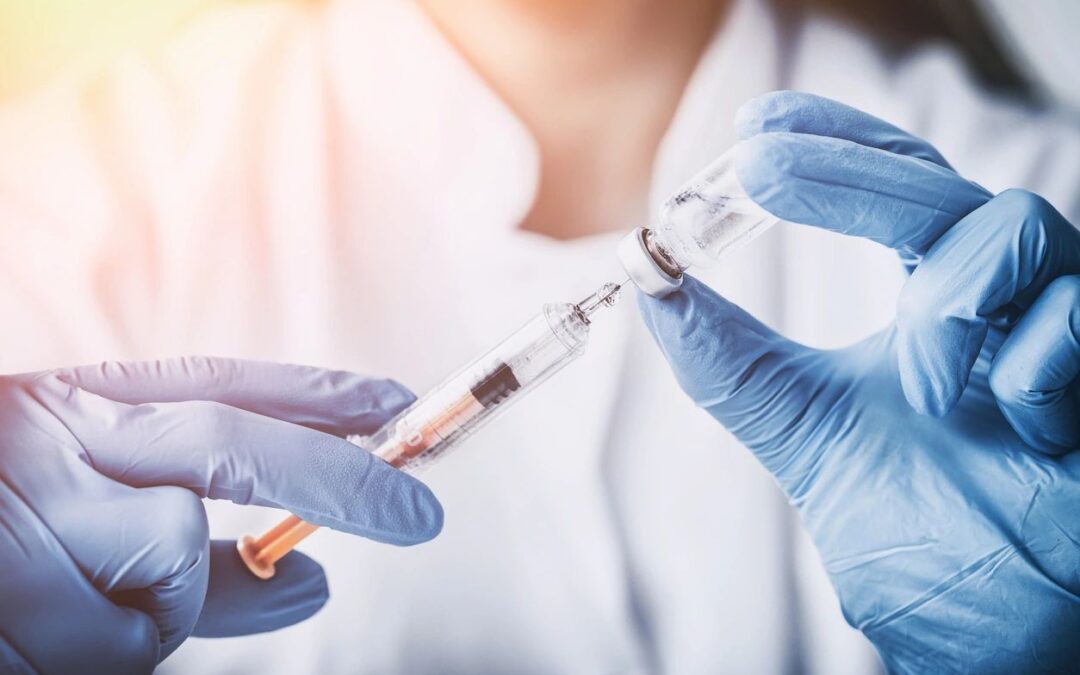 Nurse holding syringe