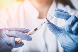 Nurse holding syringe
